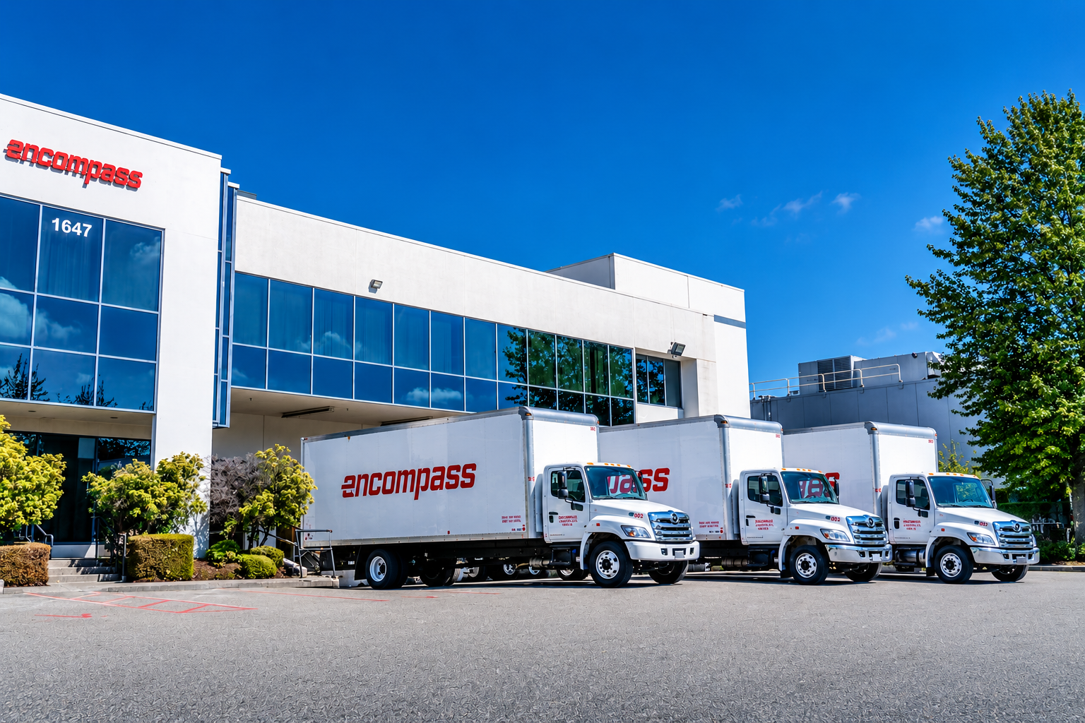 Encompass Logistics facility and delivery trucks